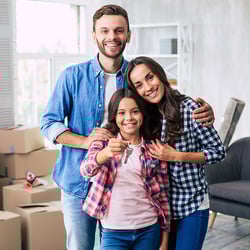 happy family unpacking in their new home