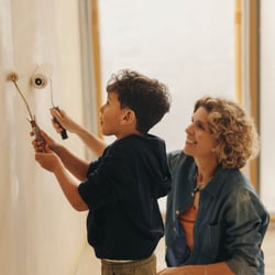mother and son painting wall