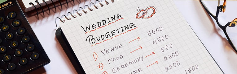 Close up of wedding expenses on notepad