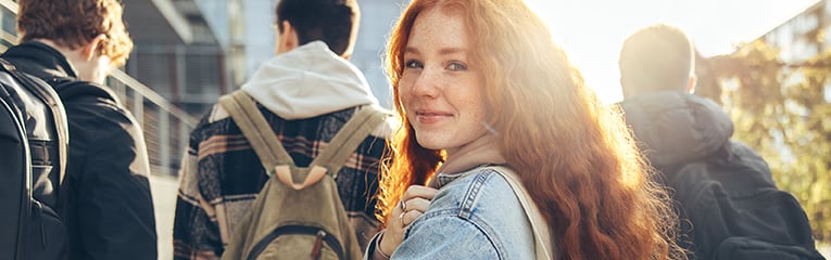 Female student going for class in high schoo