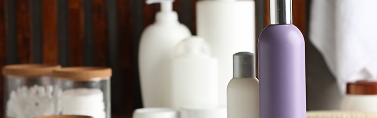 Generic Shampoo, conditioner and toiletries on white table.