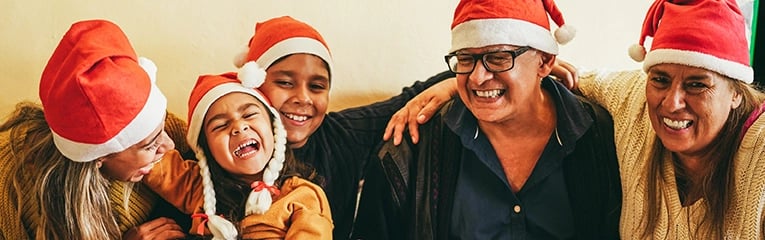 Happy latin family having fun eating together during Christmas time