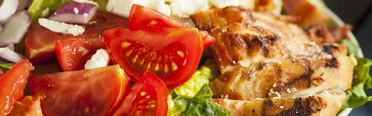 Healthy Hearty Cobb Salad with Chicken Bacon Tomato Onions and Eggs