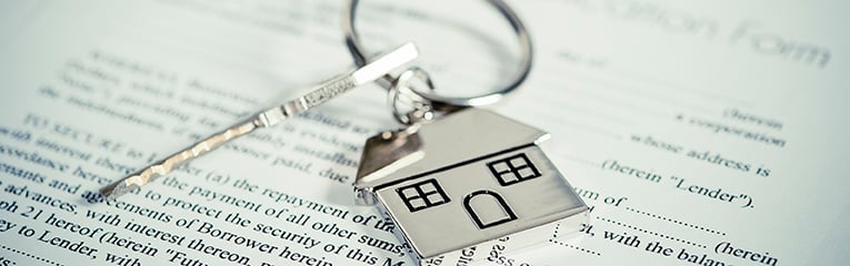 House document with keys and pen