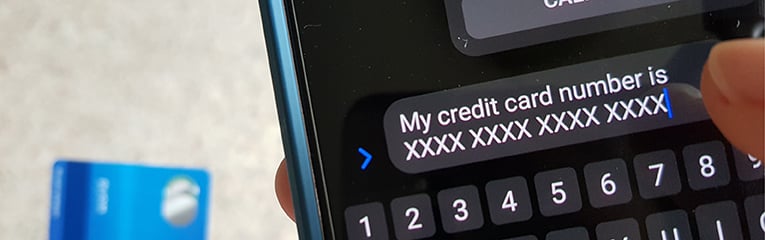 Online scam victim sending credit number to scammer