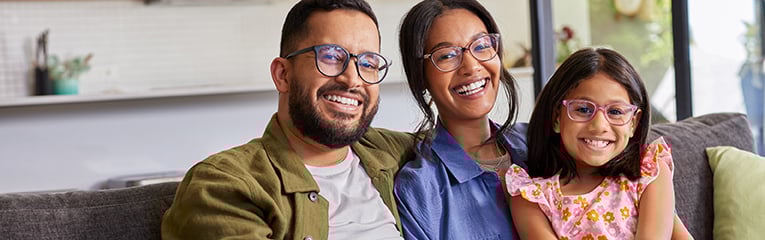 Portrait of smiling multiethnic family wearing eyeglasses stock