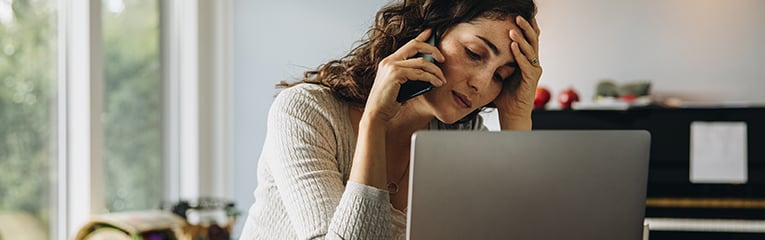 Woman feeling tired while working from home