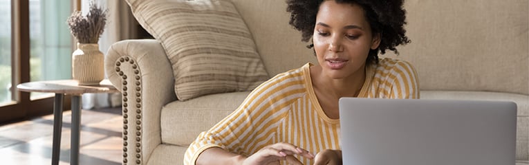 Woman managing personal budget makes e-payment