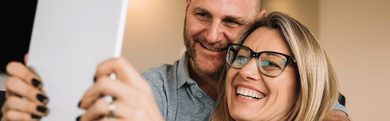 couple looking at tablet