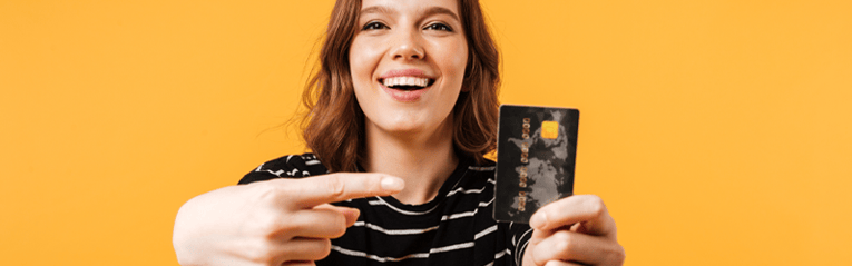 excited woman holding card