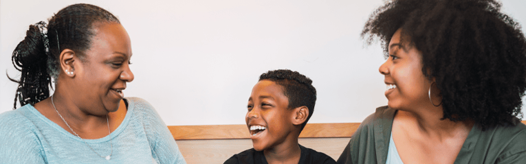 family of three laughing