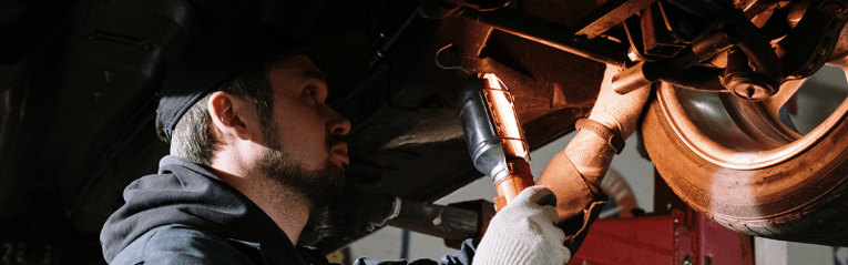 mechanic inspecting a car