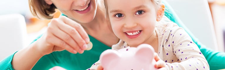 mom and child saving with a piggy bank together