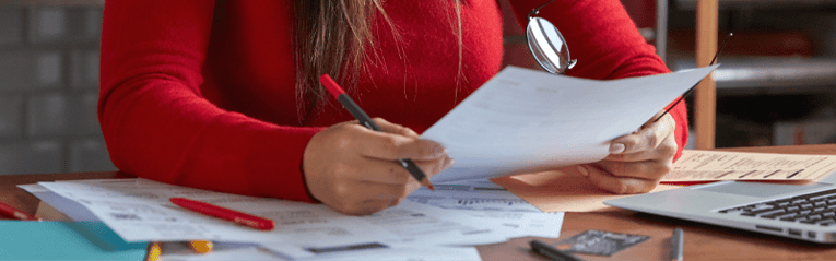 person reviewing paperwork