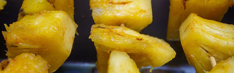 pineapple skewers with spices ready for grilling
