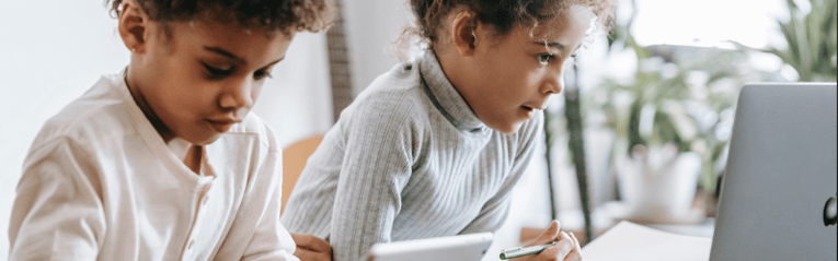 two children on screens