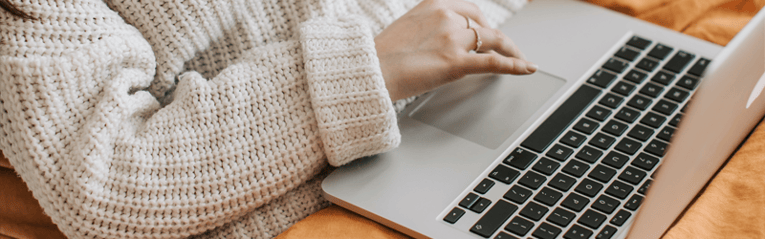 woman in bed on laptop