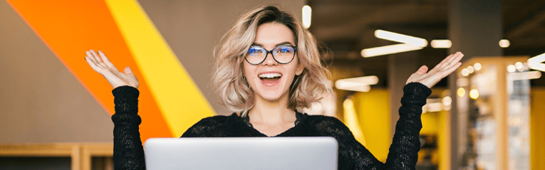 woman on laptop smiling