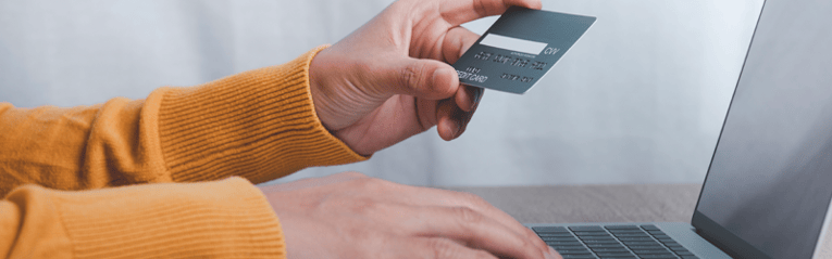 woman on laptop with credit card