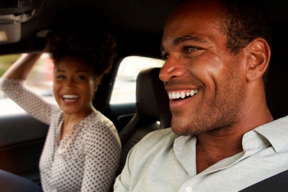 Car-loans-with-great-rates-from-Peach-State-let-this-happy-couple-drive-away-together-smiling.