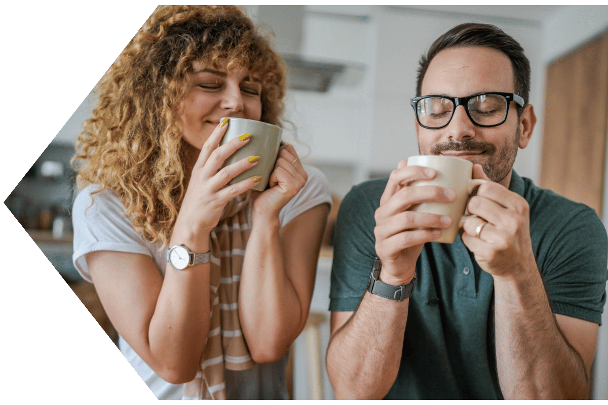 Couple enjoying coffee and peace of mind with debt protection from Peach State FCU Couple enjoying coffee and peace of mind with debt protection from Peach State FCU