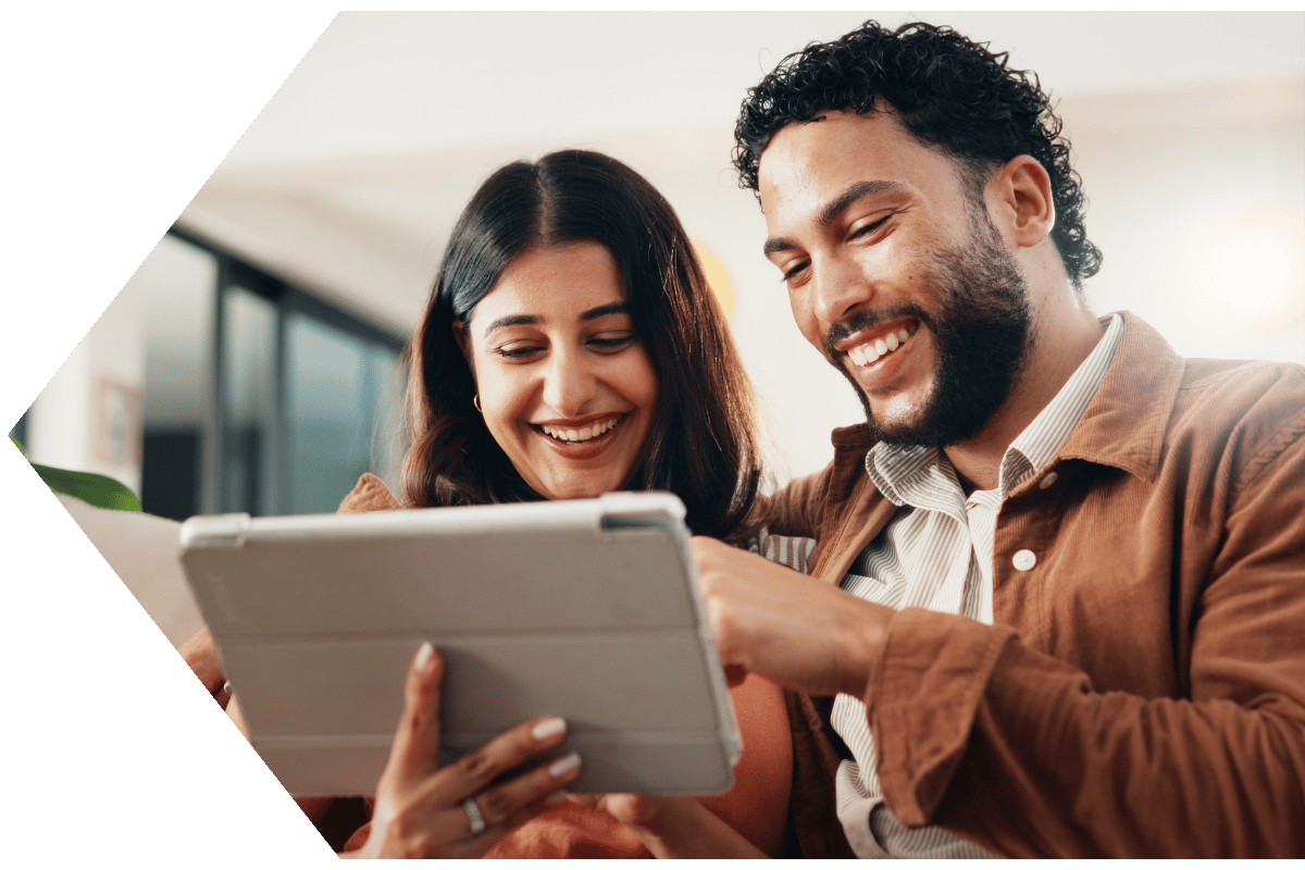 Couple reading AD&D coverage benefits Couple reading AD&D coverage benefits