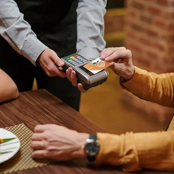 Man uses PSFCU visa debit card tap to pay feature