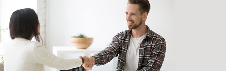 Man-shaking-hands-with-loan-officer-after-researching-and-applying-for-the-best-debt-consolidation-loans-available.