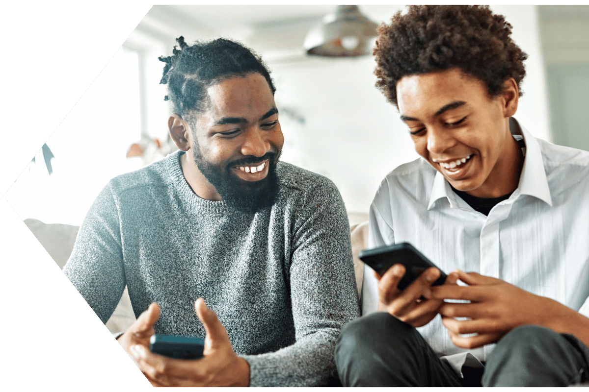 Father teaches his son how to make a direct deposit in his Peach State FCU account