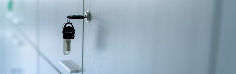 Filing cabinet locked with key for safety in an office.