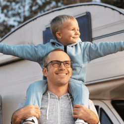 Happy family with a new RV and RV Loan from Peach State FCU