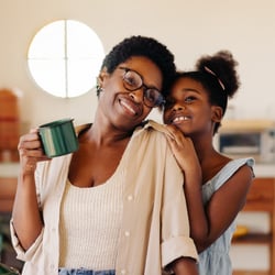 Happy woman and daughter with a HELOC from Peach State FCU