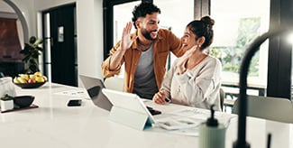 High five, laptop or happy couple celebration for budget goal, success or household bills planning.