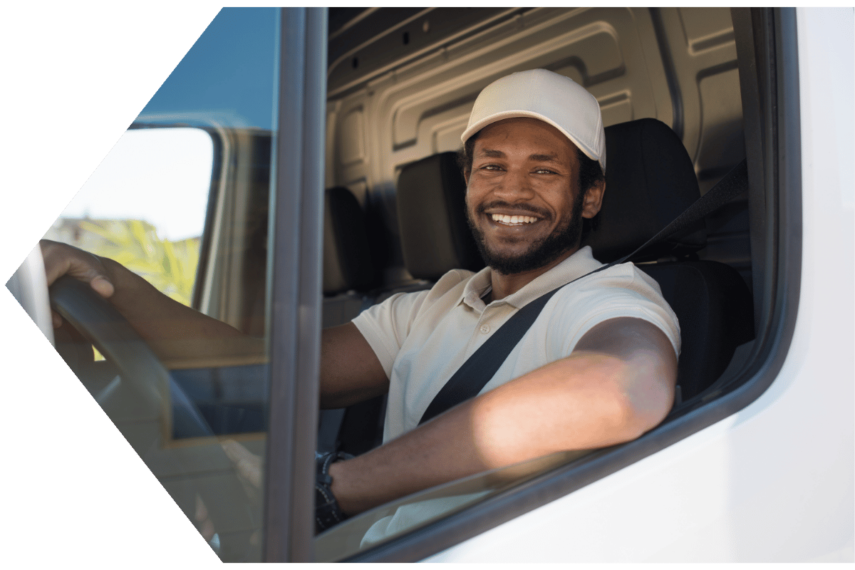 Man driving fleet vehicle with a business auto loan from Peach State FCU Man driving fleet vehicle with a business auto loan from Peach State FCU