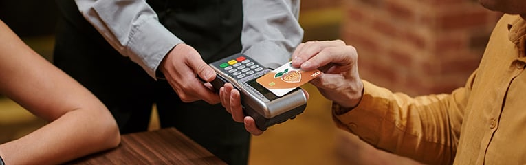 Man uses PSFCU visa debit card tap to pay feature