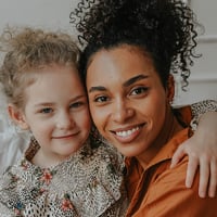 Mother and daughter smile together in personal photo