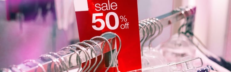 Sale tag on clothing rack