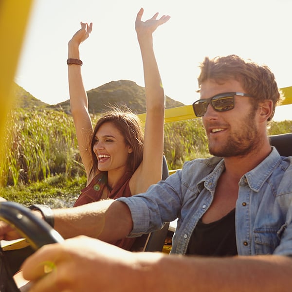 Couple enjoys ride through mountains