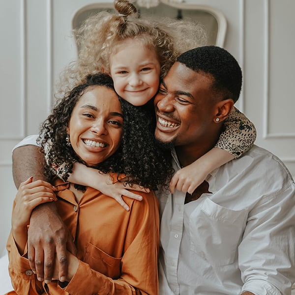Family smiles together in group photo