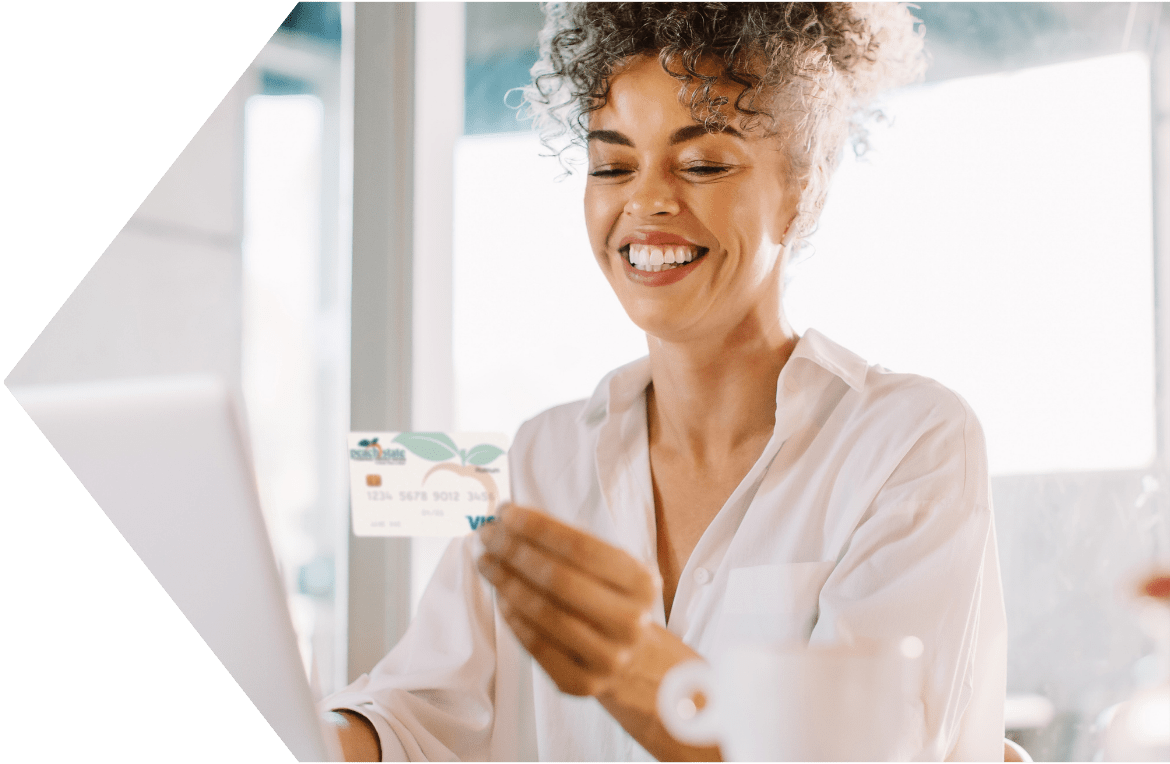 Woman shopping online with her Peach State Credit Card