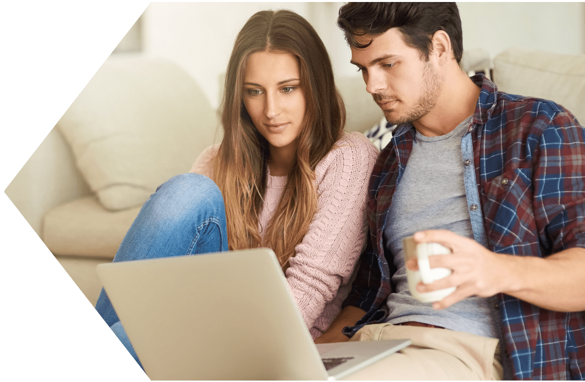 Youn couple applying for a Second Chance Checking Account with Peach State FCU