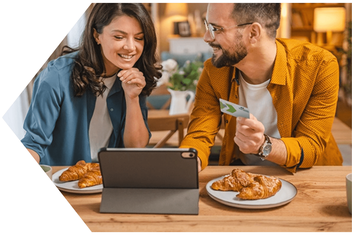 Young couple with a Peach State FCU Credit Card Young couple with a Peach State FCU Credit Card
