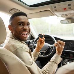 Young man excited to have a fresh start second chance auto loan from Peach State FCU