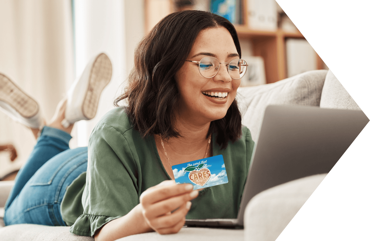 Young woman using her Peach State Teen Checking Account Young woman using her Peach State Teen Checking Account