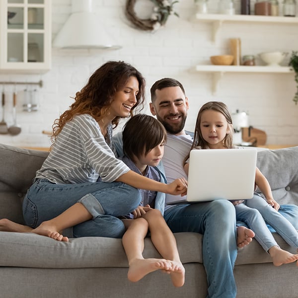 Happy family looks at Peach State's website