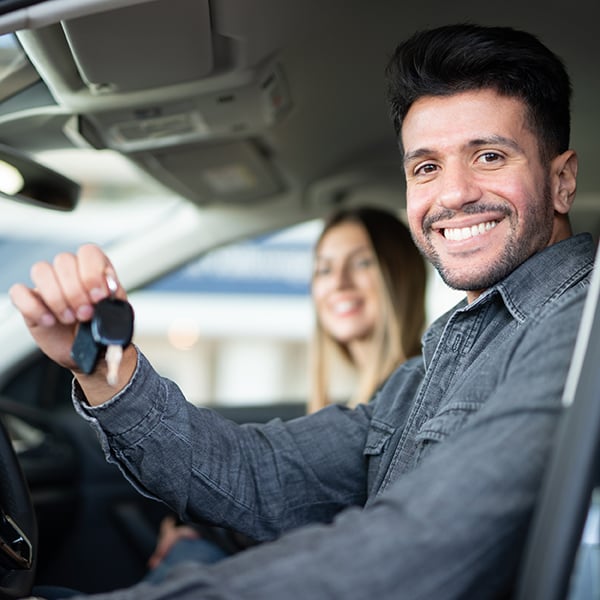 Young man purchases brand new car