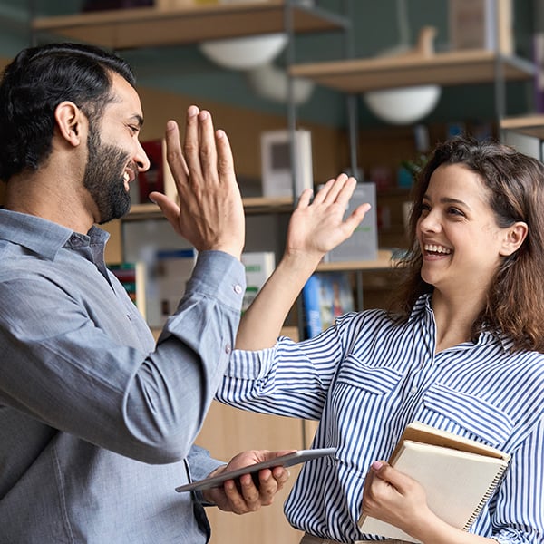 Co-workers celebrate reaching goals