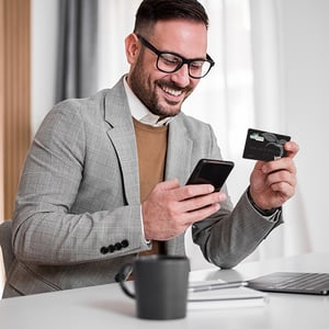 Employee checks his Peach State Business Visa account on his mobile device.