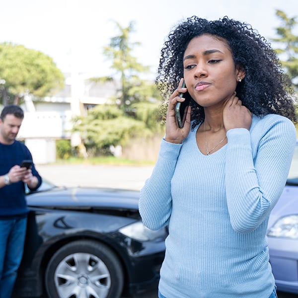 Young lady calls insurance after getting into car accident