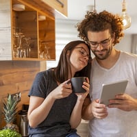 Young couple looking at mobile device